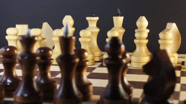 Chess game. White and black pieces on chess board. International chess day 20 july