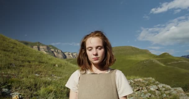 Russia, Caucasus. A young woman looks into the camera. Shooting close-up — Stock Video