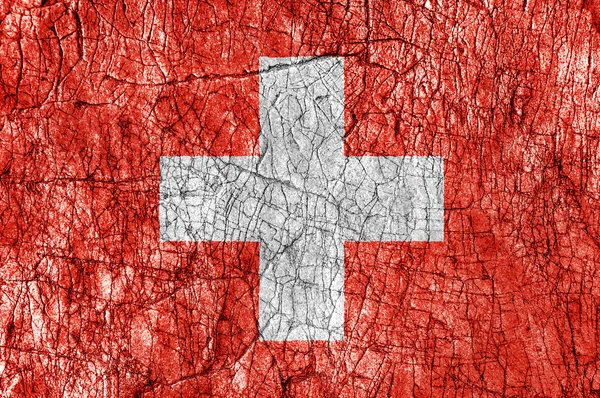 スイスの国旗を描いた石呪怨します。 — ストック写真