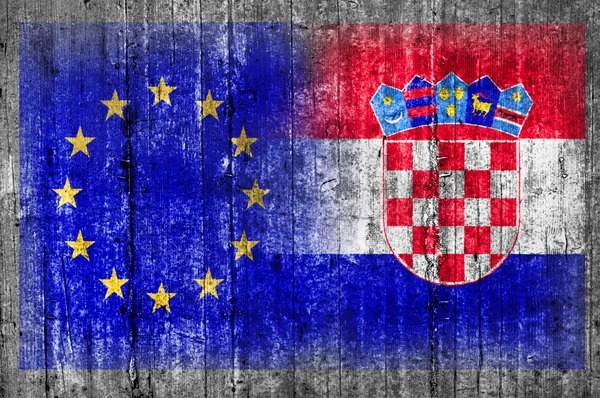 EU and Croatia flag on concrete wall — Stock Photo, Image