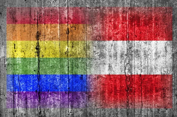 Флаг ЛГБТ и Австрии на бетонной стене — стоковое фото