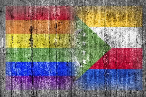 LMBT és a Comore-szigeteki zászló a betonfal — Stock Fotó