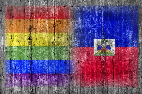 Flaga LGBT i Haiti na betonowej ścianie — Zdjęcie stockowe