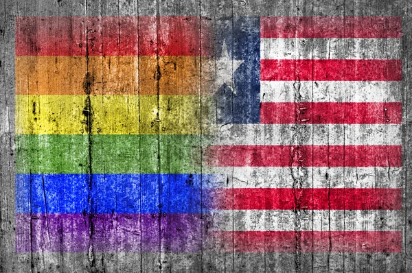 LMBT és a libériai zászló a betonfal — Stock Fotó