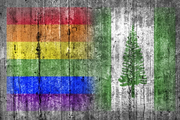 Bandera LGBT y Norfolk Island en muro de hormigón — Foto de Stock