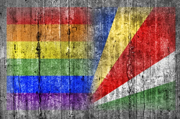 Flaga LGBT i Seszele na betonowej ścianie — Zdjęcie stockowe