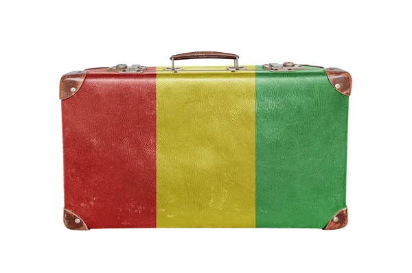 Vintage resväska med Guineas flagga — Stockfoto