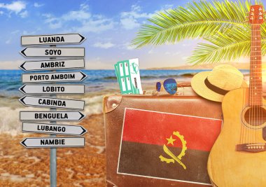 Concept of summer traveling with old suitcase and Angola town sign with burning sun clipart