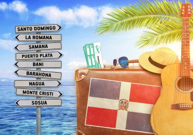 Concept of summer traveling with old suitcase and Dominican Republic town sign with burning sun clipart