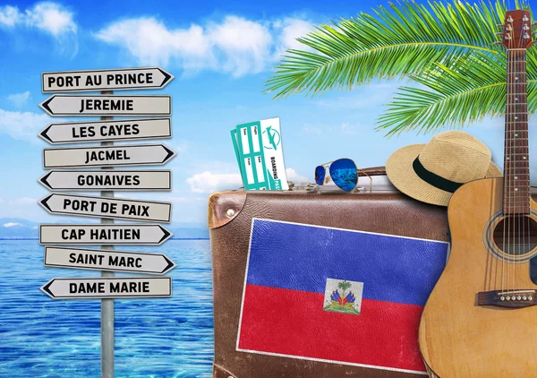 Concept van zomer reizen met oude koffer en Haïti stad teken — Stockfoto