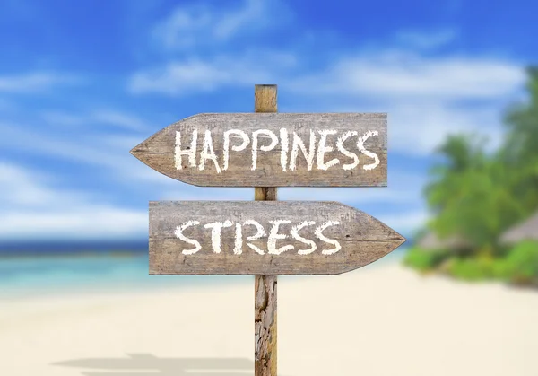 Segno di direzione in legno felicità o stress — Foto Stock
