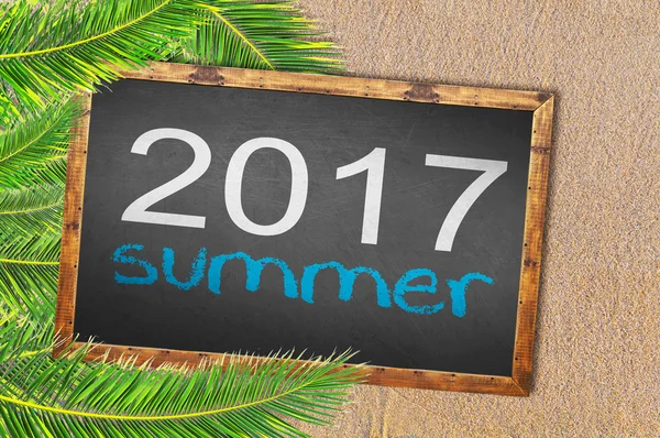 Palm trees and 2017 summer written on blackboard — Stock Photo, Image