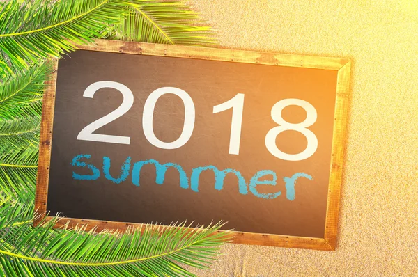 Palm trees and 2018 summer written on blackboard — Stock Photo, Image