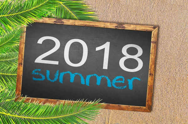 Palm trees and 2018 summer written on blackboard — Stock Photo, Image