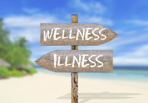 Wooden direction sign with wellness and illness