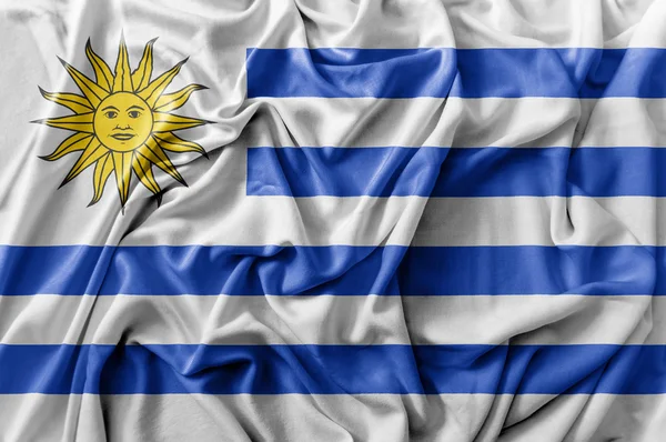 Gegolfde wuivende vlag van Uruguay — Stockfoto