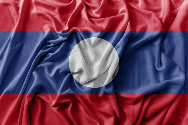 Gekräuselte schwenken laotische Flagge — Stockfoto