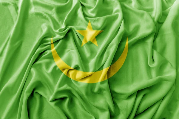 Plissé agitant drapeau mauritanien — Photo
