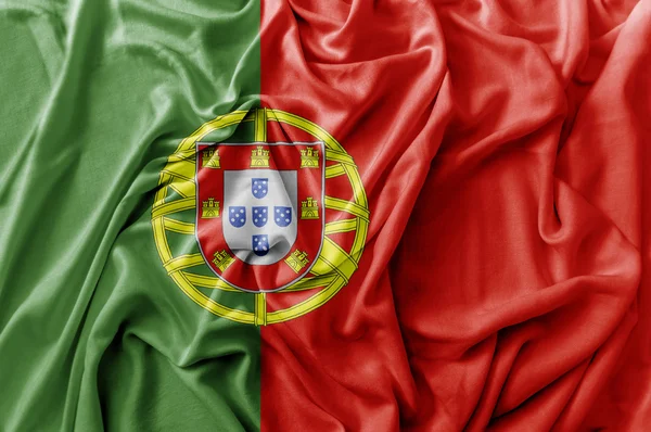 Ruffled acenando bandeira de Portugal — Fotografia de Stock