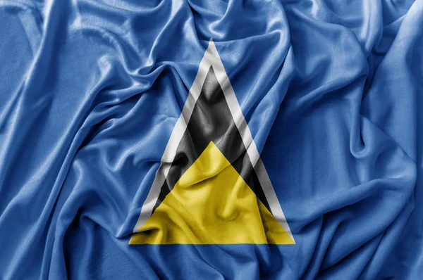 Ruffled waving Saint Lucia flag — Stock Photo, Image
