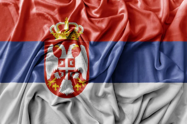 Ruffled acenando bandeira Sérvia — Fotografia de Stock