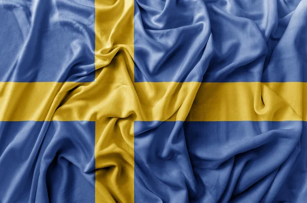 Ruggig viftande Sverige flagga — Stockfoto