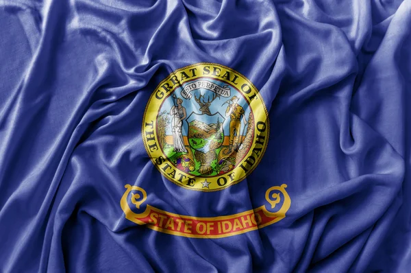 Ruffled ondeando bandera de Idaho de los Estados Unidos — Foto de Stock