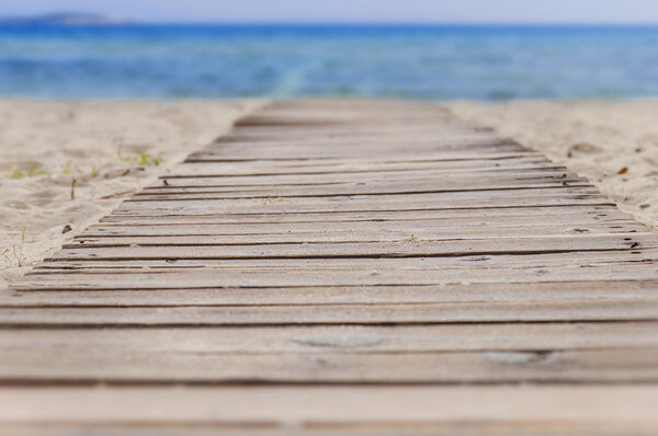 Beach wooden path and sea background