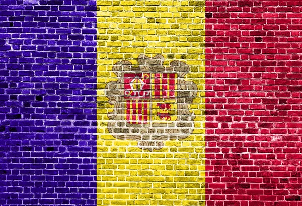 Bandera de Andorra pintada sobre pared de ladrillo, textura de fondo — Foto de Stock