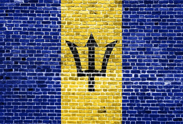 Bandera de Barbados pintada sobre pared de ladrillo, textura de fondo — Foto de Stock