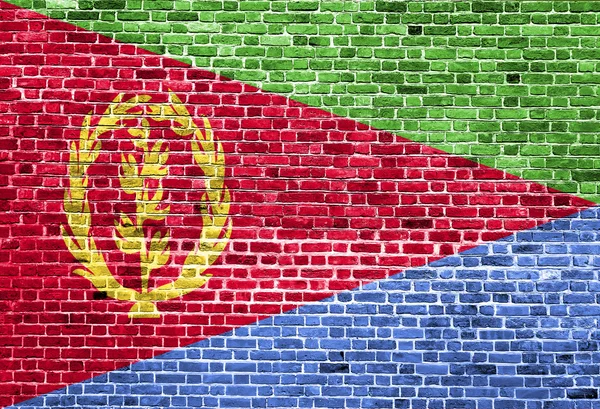 Bandera de Eritrea pintada sobre pared de ladrillo, textura de fondo — Foto de Stock