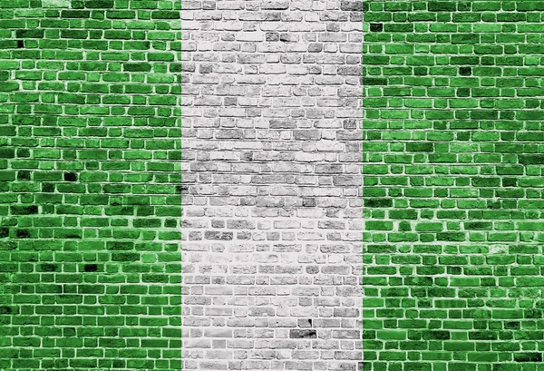 Прапор Нігерії намальовані на цегляна стіна, текстури тла — стокове фото