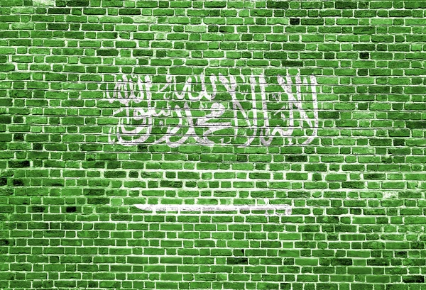 Bandera de Arabia Saudita pintada sobre pared de ladrillo, textura de fondo — Foto de Stock