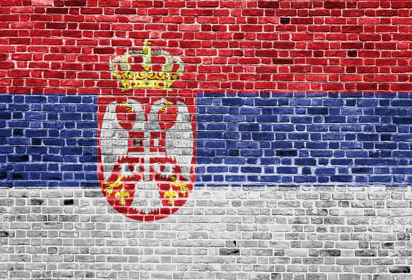 Bandera de Serbia pintada sobre pared de ladrillo, textura de fondo —  Fotos de Stock