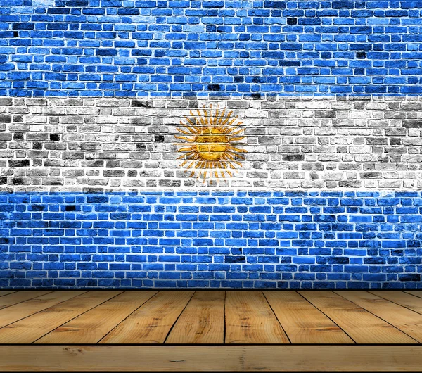 Σημαία της Αργεντινής ζωγραφισμένο σε τοίχο από τούβλα με ξύλινο πάτωμα — Φωτογραφία Αρχείου