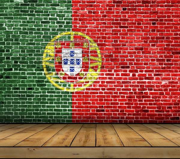 Portugal flag painted on brick wall with wooden floor — Stock Photo, Image