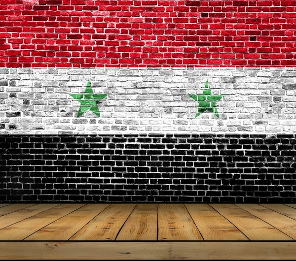 Syria flag painted on brick wall with wooden floor — Stock Photo, Image