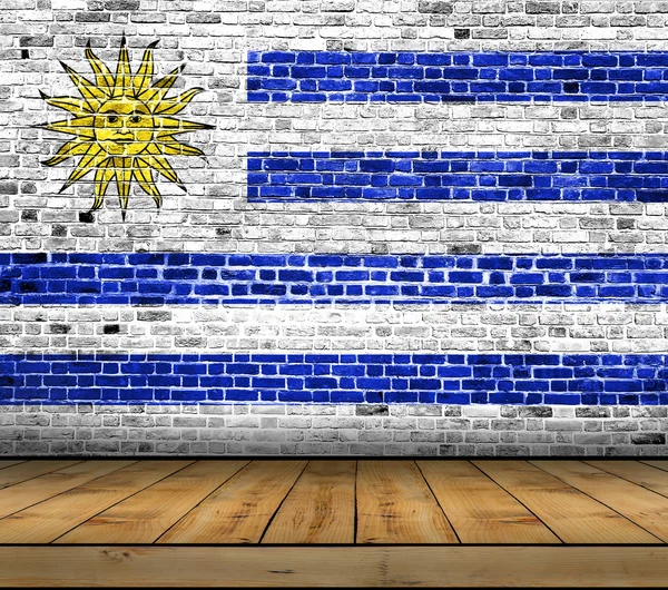 Uruguay zászló festett fa padló téglafal — Stock Fotó