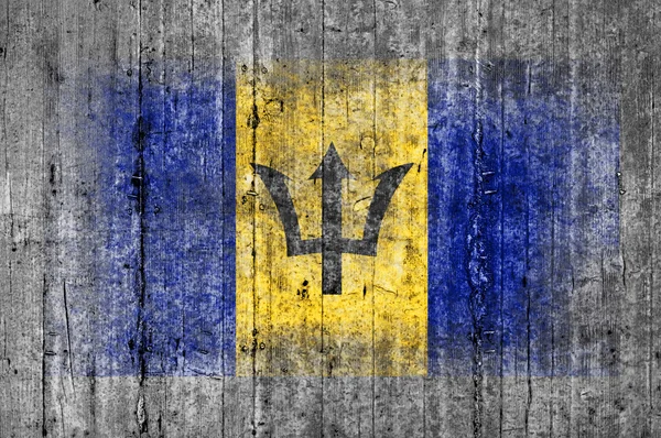 Флаг Барбадоса окрашен на фоне серого бетона — стоковое фото
