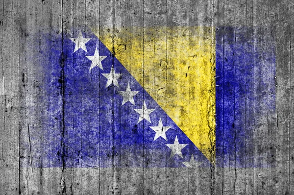 Vlajka Bosny a Hercegoviny, namalovaný na pozadí textury šedá beton — Stock fotografie