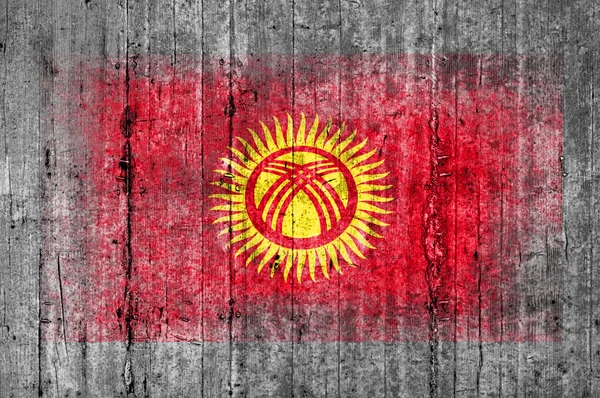 Kyrgyzstan Flagge auf Hintergrund Textur grauen Beton gemalt — Stockfoto