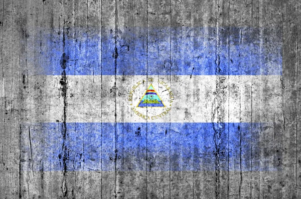 Nicaragua flag painted on background texture gray concrete — Stock Photo, Image