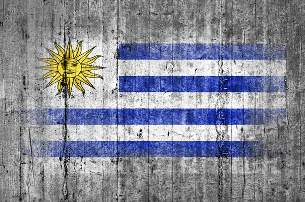 Флаг Уругвая окрашен на фоне серого бетона — стоковое фото