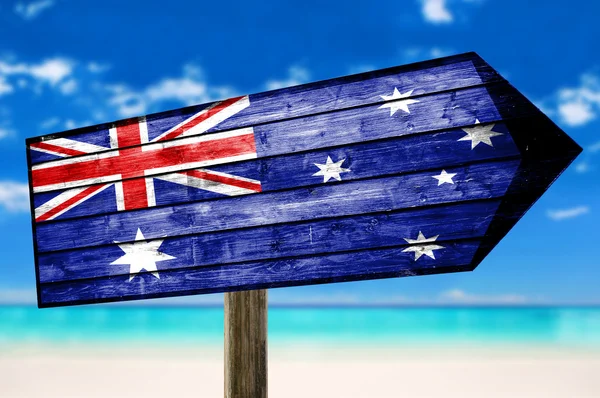 Australia flag wooden sign with a beach background — Stock Photo, Image