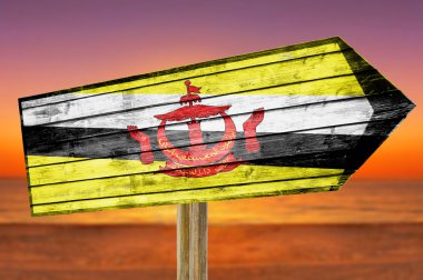 Brunei bayrağı ahşap plaj arka plan üzerinde oturum