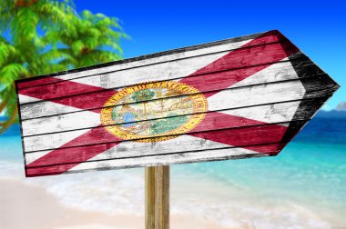 Florida bayrak ahşap plaj arka plan üzerinde oturum