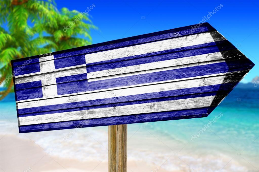 Greece Flag wooden sign on beach background