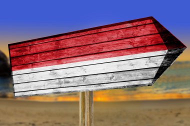 Endonezya bayrağı ahşap plaj arka plan üzerinde oturum