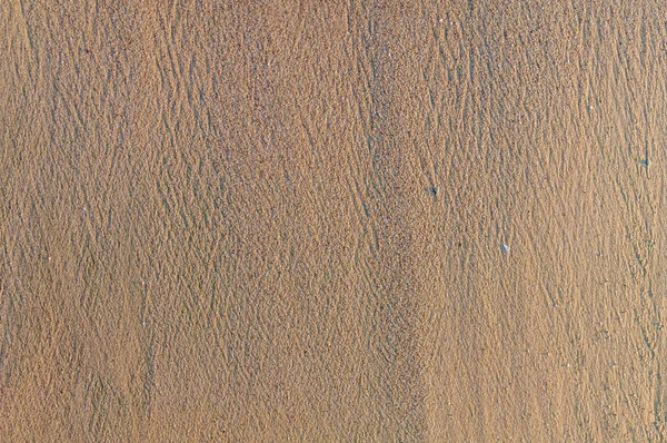 Sandy beach tło, szczegółowe tekstura piasku, widok z góry — Zdjęcie stockowe