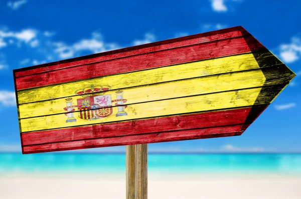 Bandera de España letrero de madera sobre fondo de playa — Foto de Stock